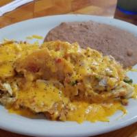 Migas Plates · Dice corn tortillas, mixed w/eggs, onion, tomato & chile. served w/ refried beans, cheese & ...