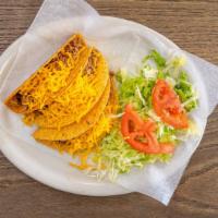 Crispy Taco Plate · Three crispy tacos of ground beef, lettuce, tomato and white cheese on top accompanied with ...