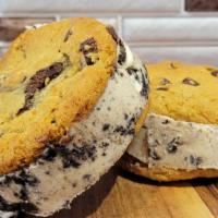 Cookies & Cream Ice Cream Cookie Sandwich · Two of our chocolate chip cookies and a slab of cookies and cream ice cream in between.