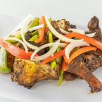Jerk Chicken Platter · Six pieces of juicy jerk chicken marinated over night and topped with tasty vegetables.