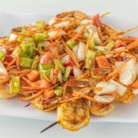 Rock The Shrimp Platter · Four shrimp skewers marinated with the finest west african spices and sautéed vegetables. Th...