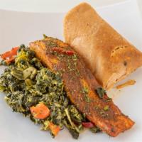 Salmon W/ Moi-Moi And Spinach · Freshly prepared salmon and moi-moi with sautéed spinach.