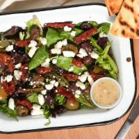 Mediterranean Salad · Mixed greens, olives, feta cheese, and sun-dried tomatoes in a garlic olive oil and lemon ju...