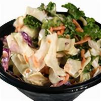 Slaw · A shredded blend of Cabbage, Carrots, and Kale mixed with our house-made Slaw dressing (6 oz)