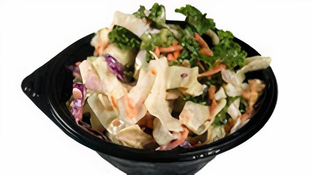 Slaw · A shredded blend of Cabbage, Carrots, and Kale mixed with our house-made Slaw dressing (6 oz)