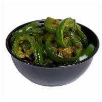 Grilled Jalapenos · Jalapeños freshly sliced and grilled to perfection