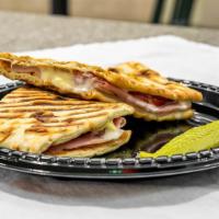 Panini Club · Ham, turkey, bacon, pepper jack cheese, ranch dressing, red onions, and tomato slices