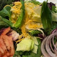 Garden Salad · A Blend of Iceberg & Spinach Topped with Tomatoes, Red Onions, Broccoli, and Cheddar Cheese