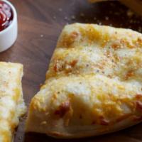 Cheese Breadsticks · Freshly baked with melted 3 cheese blend and served with Romeo's Original Pizza Sauce