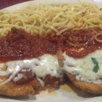 Chicken Parmigiana · Lightly breaded chicken breast cooked with tomato sauce and topped with mozzarella cheese.