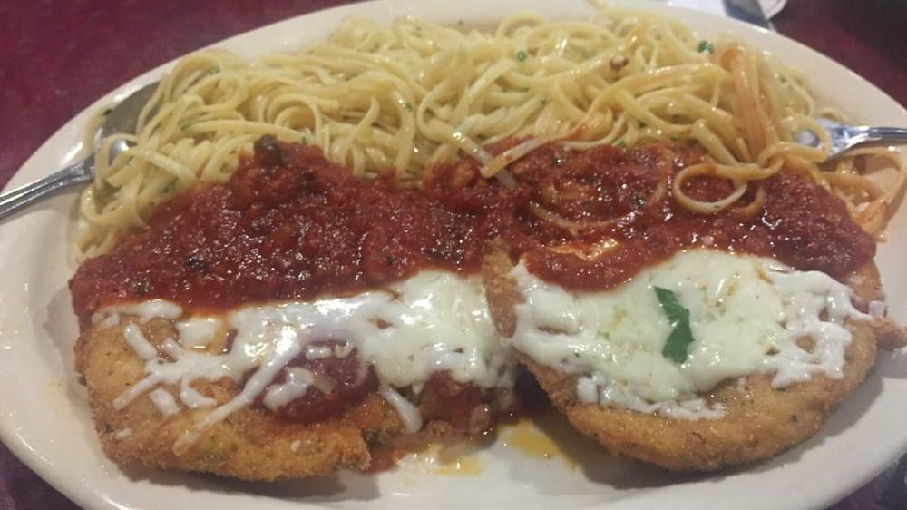 Chicken Parmigiana · Lightly breaded chicken breast cooked with tomato sauce and topped with mozzarella cheese.