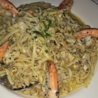 Linguine With Shrimp & Clam Sauce · Fresh clams and jumbo shrimp tossed in garlic and onion in your choice of red or white sauce.