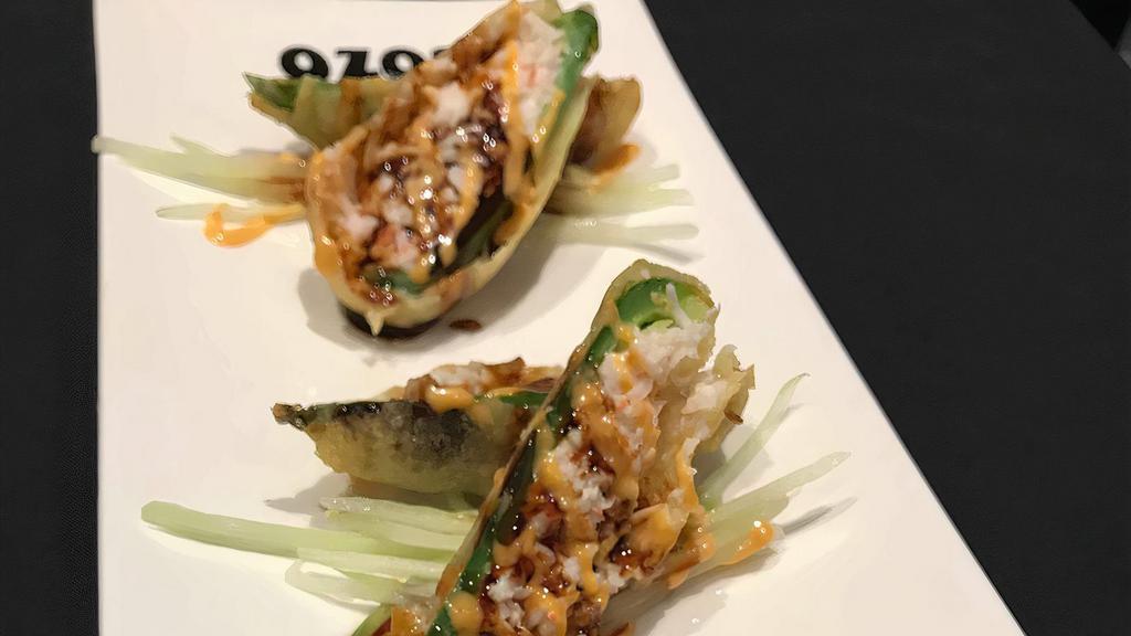 Stuffed Jalapeno · Tempura-fried jalapeno stuffed with cream cheese, mayo, & snow krab mix. Topped with eel sauce and spicy mayo