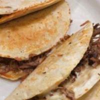 Mini Tacos · Five mini tacos, onions, cilantro, one chile toreado, asada, pastor.