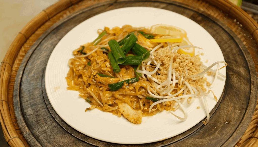 Pad Thai · Stir fried rice noodles with egg, bean sprouts and scallion in Thai special sauce and ground peanuts.