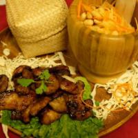 Moo Yang  · Grilled marinated pork Northern Thai style and Thai fresh papaya salad served with tradition...