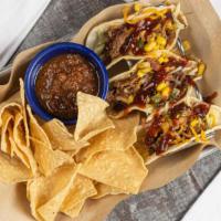 Brisket Tacos · Chopped brisket, shredded lettuce, roasted corn pico, spicy bbq sauce and Queso cheese. Add ...