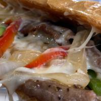 Philly Steak · 5 oz. thinly sliced beef, choice of cheese, grilled onions & peppers