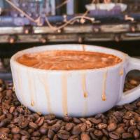 Graham Cracker Latte · Latte made with oat milk, honey, vanilla, & topped with cinnamon powder