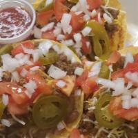 Tostadas (3) · Refried Beans, Ground Beef, Cheese, Vegetables, and Salsa