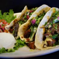 Carne Asada Tacos · Grilled Carne Asada, White Queso, Mushrooms, Onions, Poblano Peppers, Flour Tortillas, Sour ...