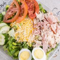 Chef Salad · 350 calorie. Romaine hearts, tomatoes, purple cabbage, carrots, cucumbers, and eggs topped w...