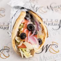Gyro · Roasted beef and lamb on gyro bread with tzatziki sauce topped with lettuce, tomatoes, and o...