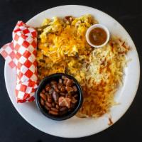 Eggs Migas · Scrambled eggs with cheese, corn tortillas, tomato, onion and jalapeño.