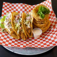 Fish Tacos · 3 fried tacos in crisp flour tortillas with our house made cajun slaw and fresh pico de gallo.