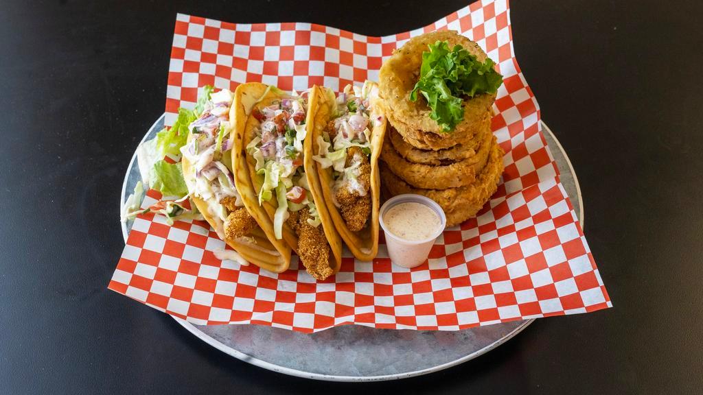 Fish Tacos · 3 fried tacos in crisp flour tortillas with our house made cajun slaw and fresh pico de gallo.