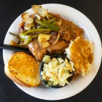 Smothered Pork Chops · 2 pork chops fried and smothered in brown gravy, peppers and onion. Pure southern Deliciousn...