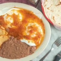 Huevos Rancheros Plate · Your Choice of Eggs with Salsa Ranchera on top. Served with refried beans and potatoes.