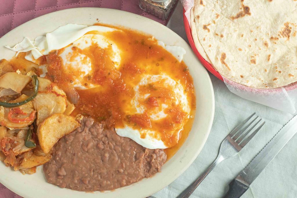 Huevos Rancheros Plate · Two eggs any style topped with our ranchero sauce.