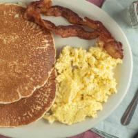Pancakes Plate · Two pancakes, two eggs any style and two strips of bacon.