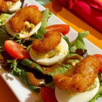 Huevos Diablos · 4 deviled eggs topped with a fried shrimp, hint of jalapeno served over spring mixed greens ...