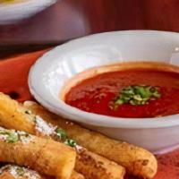 Mozzarella Fritti (8 Pcs) · Fresh-cut Wisconsin mozzarella, lightly breaded, and fried to a golden brown. Served with Ru...
