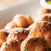 Truffle Garlic Knots · Hand-knotted pizza dough tossed with truffle olive oil, fresh garlic, and pecorino romano ch...