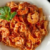 Shrimp Rosso · Jumbo gulf shrimp with prosciutto, onions, sherry wine, and tomato cream sauce with mafaldin...