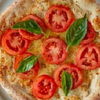 Margherita Pizza · Roma tomatoes, fresh basil, garlic, Wisconsin mozzarella, and Sicilian extra-virgin olive oil.