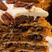 Carrot Cake · Studded with raisins, walnuts, and pineapple, and finished with a smooth cream cheese icing.