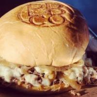 Steak · Thinly sliced ribeye steak with grilled onions topped with provolone.