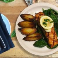 Grilled Scottish Salmon · organic scottish wild isle salmon topped with lemon butter
served with herb roasted potatoes...