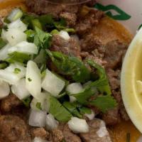 Tacos De Birria · 4 tacos de birria 
Cilantro and onions on the side
Served with consome