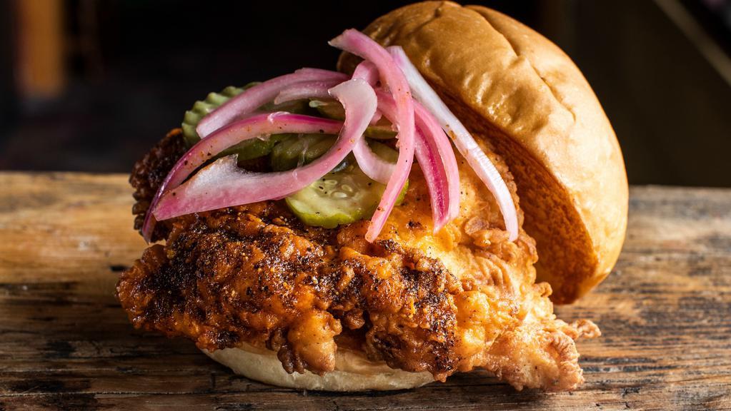 Nashville Hot Chicken Sandwich · Crispy chicken tossed in our house-made spice blend and topped with pickled red onions and pickles. 1050 cal