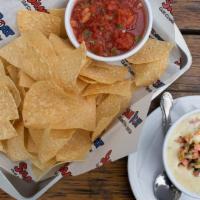 Queso Blanco Cup · Served with salsa + fresh tortilla chips