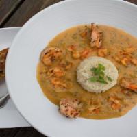 Shrimp + Crawfish Etouffee · Crawfish tails + jumbo shrimp smothered in a buttery blend of onions, peppers, celery, garli...