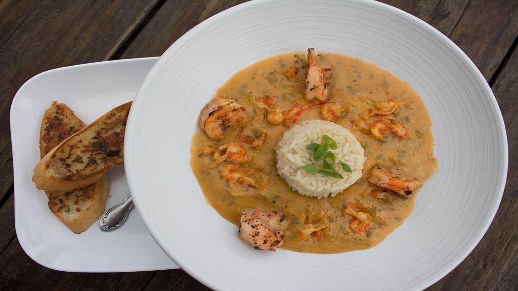 Shrimp + Crawfish Etouffee · Crawfish tails + jumbo shrimp smothered in a buttery blend of onions, peppers, celery, garlic, served over rice