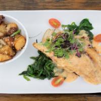 Stuffed Redfish · Pan-seared Redfish fillet stuffed with a crab cake, topped with lemon butter on a bed of spi...