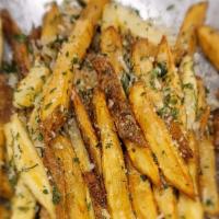 Truffle Fries · Coated in garlic, Parmesan, parsley, and truffle oil.