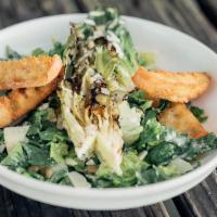 Romaine Caesar Salad · Grilled romaine, capers, Parmesan, flash-fried croutons, and Caesar dressing.